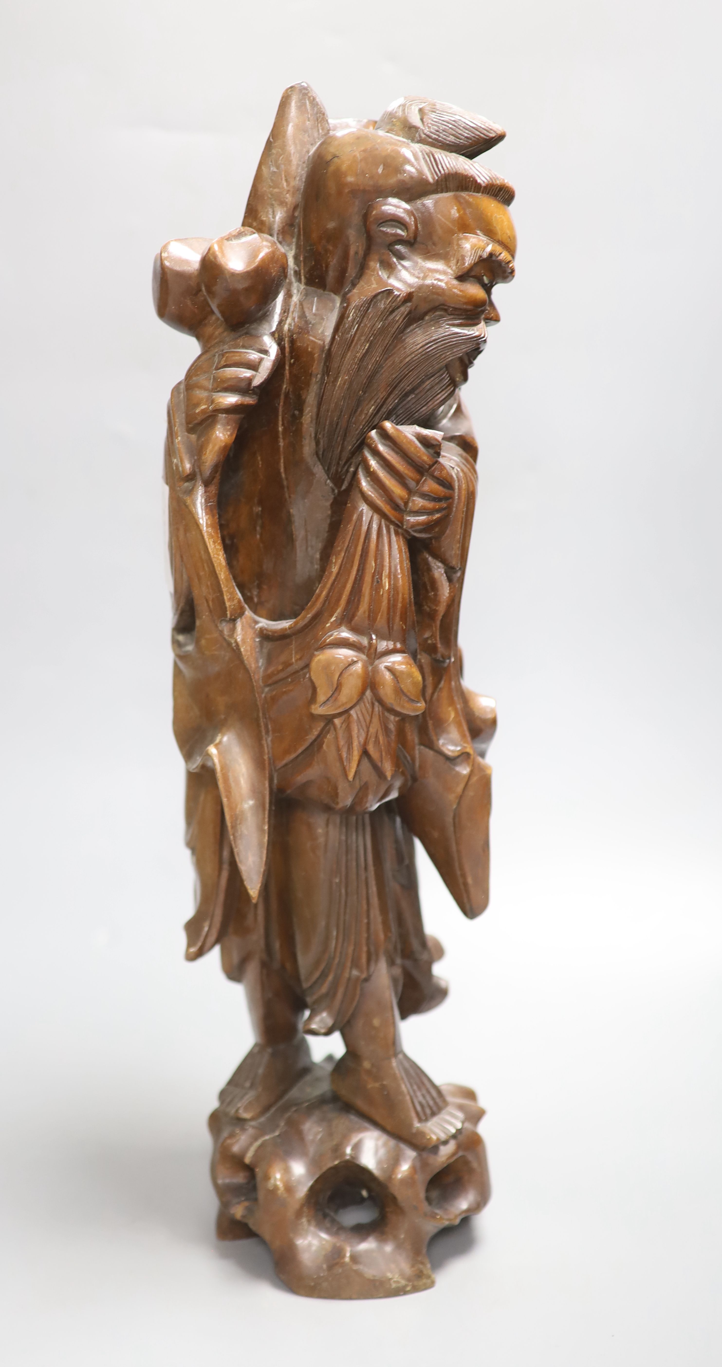 A Chinese hardwood carving of Shou, height 54cm